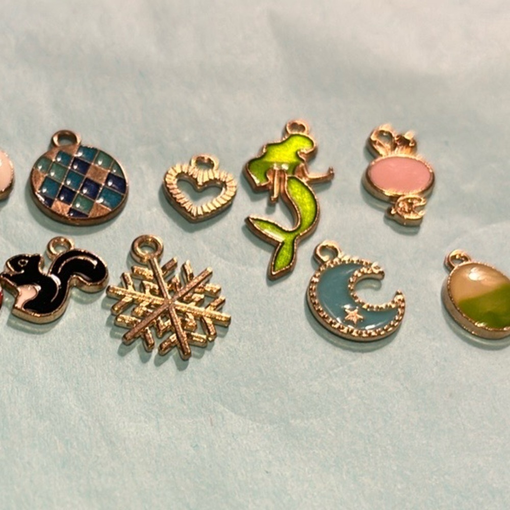Bracelet or necklace charms 13 of them gold based